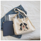 Floral pet illustration example on the ivory large-capacity canvas tote with short handles and detachable shoulder strap.